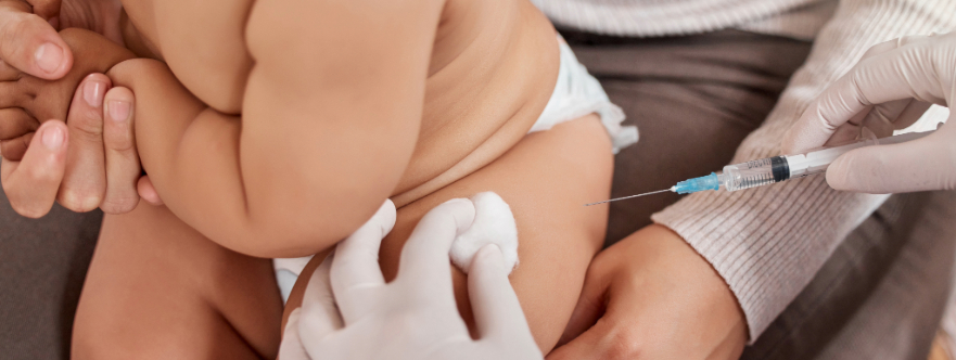 Infant receiving a vaccine