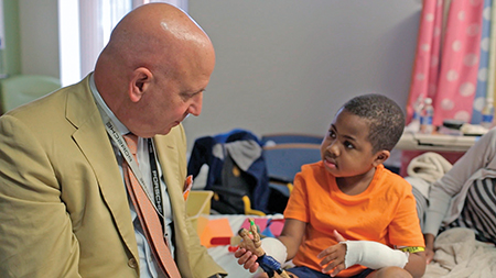 L. Scott Levin, M.D., FACS, led the hand transplant surgery performed on Zion Henry, 8. Photo courtesy of The Children's Hospital of Philadelphia.