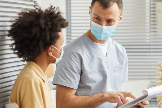 Doctor talking to youth