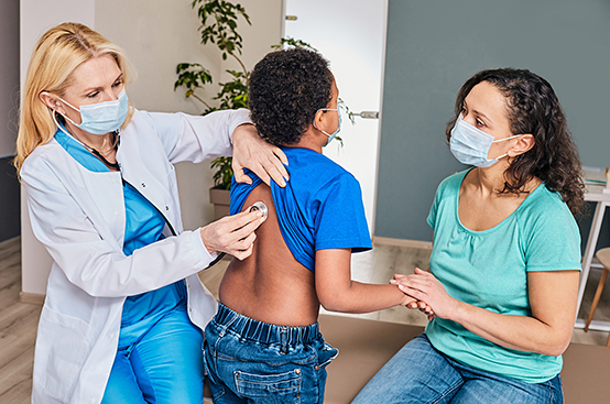 Doctor examining child